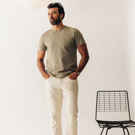 fit model walking wearing The Organic Cotton Tee in Sage, Knits by Taylor Stitch