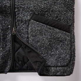 material shot of the zipper and pockets on The Port Vest in Coal Marl Boucle Fleece, Outerwear by Taylor Stitch