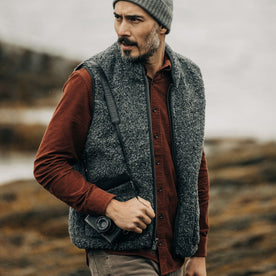 fit model walking wearing The Port Vest in Coal Marl Boucle Fleece, Outerwear by Taylor Stitch