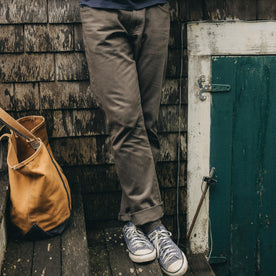 fit model posing in The Slim All Day Pant in Fatigue Olive Selvage Denim, Bottoms by Taylor Stitch