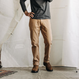 fit model posing in The Slim All Day Pant in Tobacco Selvage Denim, Bottoms by Taylor Stitch