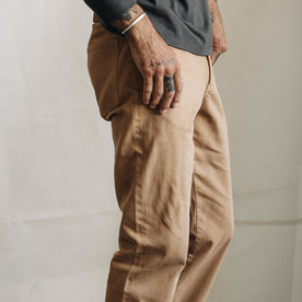 fit model showing the side of The Slim All Day Pant in Tobacco Selvage Denim, Bottoms by Taylor Stitch