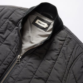 material shot of the collar on The Able Jacket in Faded Black Quilted Nylon, Outerwear by Taylor Stitch