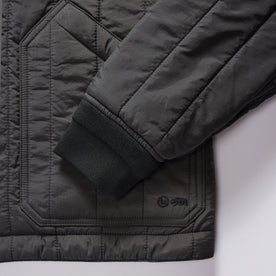 material shot of the cuffs on The Able Jacket in Faded Black Quilted Nylon, Outerwear by Taylor Stitch