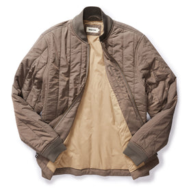 flatlay of The Able Jacket in Morel Quilted Nylon, shown open, Outerwear by Taylor Stitch