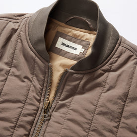 material shot of the collar on The Able Jacket in Morel Quilted Nylon, Outerwear by Taylor Stitch