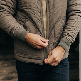 fit model zipping up The Able Jacket in Morel Quilted Nylon, Outerwear by Taylor Stitch