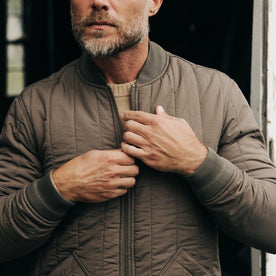 fit model zipping The Able Jacket in Morel Quilted Nylon, Outerwear by Taylor Stitch