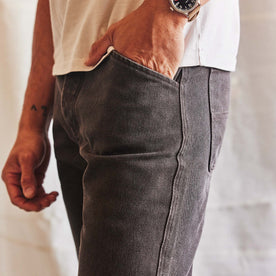 fit model with his hand in his pocket wearing The Camp Pant in Soil Chipped Canvas, Bottoms by Taylor Stitch