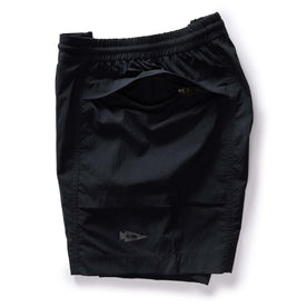 material shot of the hidden zipper pocket on The Challenge Cargo Short in Black, Bottoms by Taylor Stitch