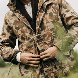 fit model buttoning The Explorer Jacket in Vintage Arid Camo Dry Wax, Outerwear by Taylor Stitch