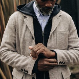 fit model adjusting the sleeves on The Gibson Jacket in Heathered Oat Nep Herringbone, Outerwear by Taylor Stitch