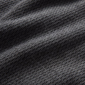 material shot of the waffle knit on The Heavy Bag Waffle Short Sleeve in Faded Black, Knits by Taylor Stitch