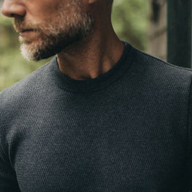 fit model showing off collar on The Heavy Bag Waffle Short Sleeve in Faded Black, Knits by Taylor Stitch