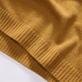 material shot of the ribbed hem on The Lodge Sweater in Gold, Knits by Taylor Stitch