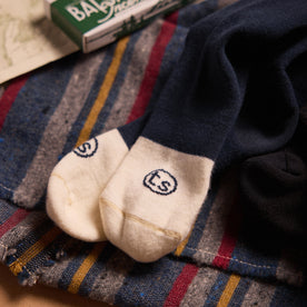 material shot of the logo on the toes of The Merino Sock in Navy, Accessories by Taylor Stitch