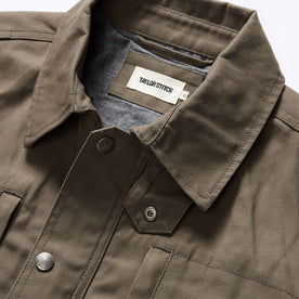 material shot of the collar on The Pathfinder Jacket in Fatigue Olive Dry Wax, Outerwear by Taylor Stitch