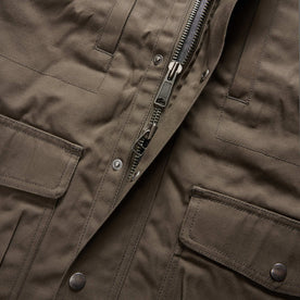 material shot of the zipper on The Pathfinder Jacket in Fatigue Olive Dry Wax, Outerwear by Taylor Stitch