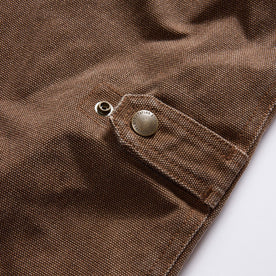 material shot of the cinching detail on The Workhorse Vest in Aged Penny Chipped Canvas, Outerwear by Taylor Stitch