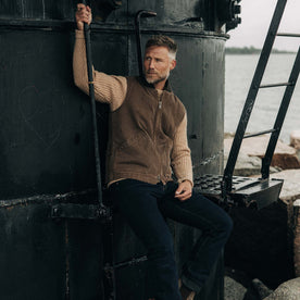 fit model sitting wearing The Workhorse Vest in Aged Penny Chipped Canvas, Outerwear by Taylor Stitch