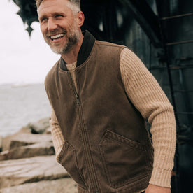 fit model posing in The Workhorse Vest in Aged Penny Chipped Canvas, Outerwear by Taylor Stitch