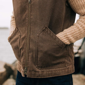 fit model with his hands in his pockets of The Workhorse Vest in Aged Penny Chipped Canvas, Outerwear by Taylor Stitch