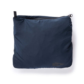 material shot of the small bag that holds The Deploy Packable Shell in Dark Navy, Outerwear by Taylor Stitch