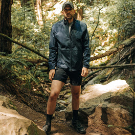 fit model posing in The Deploy Packable Shell in Dark Navy, Outerwear by Taylor Stitch