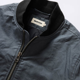 material shot of the ribbed neck on The Bomber Jacket in Charcoal Dry Wax, Outerwear by Taylor Stitch