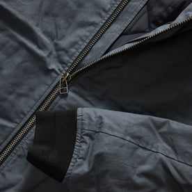 material shot of the YKK two way separating zipper on The Bomber Jacket in Charcoal Dry Wax, Outerwear by Taylor Stitch