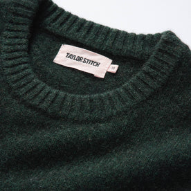 material shot of the ribbed neck opening on The Lodge Sweater in Black Pine, Knits by Taylor Stitch