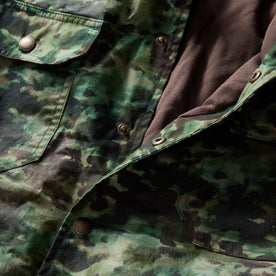 material shot of the snap buttons on The Venture Jacket in Painted Camo Waxed Canvas, Outerwear by Taylor Stitch