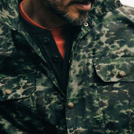 fit model showing the front snap buttons on The Venture Jacket in Painted Camo Waxed Canvas, Outerwear by Taylor Stitch