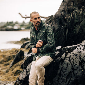 fit model adjusting the sleeves on The Venture Jacket in Painted Camo Waxed Canvas, Outerwear by Taylor Stitch