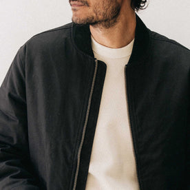 fit model showing the front of The Insulated Bomber Jacket in Coal Dry Wax, Outerwear by Taylor Stitch