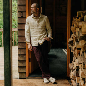 fit model leaning against the wall wearing The Breakwater Pant in Nutmeg Donegal, Bottoms by Taylor Stitch