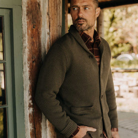 fit model with his hand in his pocket wearing The Crawford Sweater in Fatigue Olive, Knits by Taylor Stitch