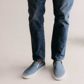 fit model showing off bottom hem on The Democratic Jean in Mid Wash Organic Selvedge, Bottoms by Taylor Stitch