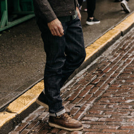 fit model walking wearing The Democratic Jean in Rigid Organic Selvedge, Bottoms by Taylor Stitch