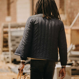 fit model showing off the back of The Ember Jacket in Dark Navy Quilted Nylon, Outerwear by Taylor Stitch