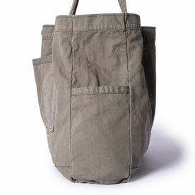 editorial image of the side pocket on The Foundation Tote in Organic Smoked Olive, Accessories by Taylor Stitch