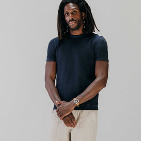 fit model with his arms crossed wearing The Organic Cotton Short Sleeve Crew in Dark Navy Waffle, Knits by Taylor Stitch