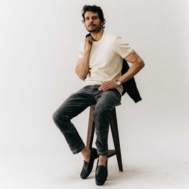 fit model sitting wearing The Organic Cotton Short Sleeve Crew in Vintage White Waffle, Knits by Taylor Stitch