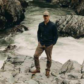 fit model posing in The Pathfinder Cap in Fatique Olive Dry Wax, Accessories by Taylor Stitch