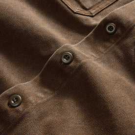 material shot of the buttons on The Shop Shirt in Aged Penny Chipped Canvas, Wovens by Taylor Stitch