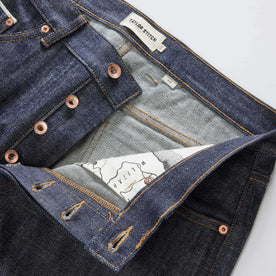 material shot of the button fly on The Slim Jean in Rigid Organic Selvedge, Bottoms by Taylor Stitch