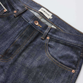 material shot of the waistband on The Slim Jean in Rigid Organic Selvedge, Bottoms by Taylor Stitch