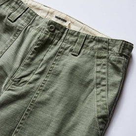 material shot of the waistband on The Surplus Pant in Field Olive Reverse Sateen, Bottoms by Taylor Stitch