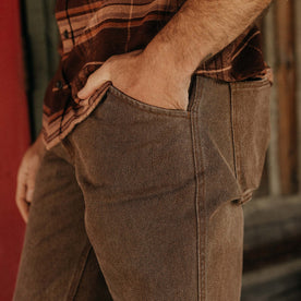 fit model with his hands in his pockets wearing The Camp Pant in Aged Penny Chipped Canvas, Bottoms by Taylor Stitch