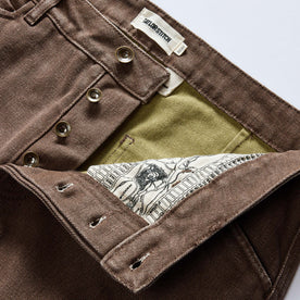 material shot of the button fly on The Camp Pant in Aged Penny Chipped Canvas, Bottoms by Taylor Stitch